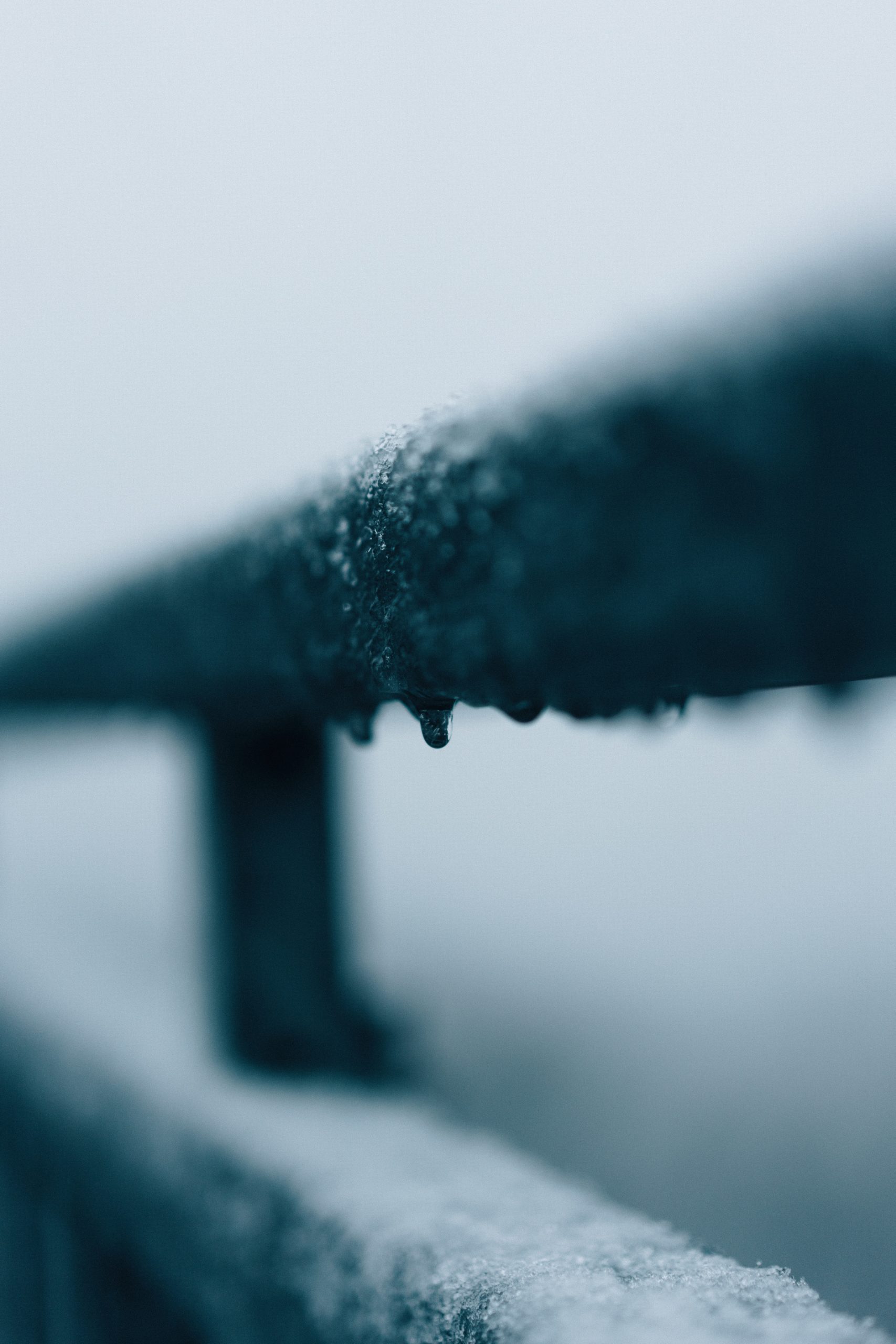 water droplets on black metal bar